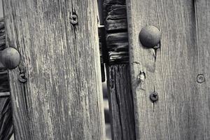 Wooden surface showing planks and grain textures in high resolution. photo