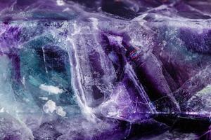 Macro mineral stone Fluorite crystal on a black background photo