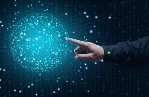 male hand touches the global virtual network of the globe. Information exchange, communication and technology development photo