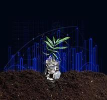 can of coins on the ground and a growing graph of indicators. Performance growth concept photo