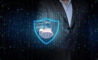 a man with a metal lock stands in front of a virtual screen with a binary code. Data verification, device and network control. Data protection, search for information leakage photo