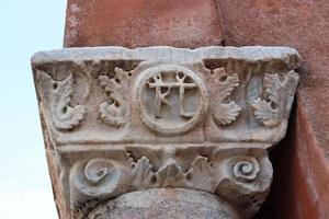 Close up vintage old pillar with vignetting in Venice, Italy. Mediterranean architecture. Street scene photo