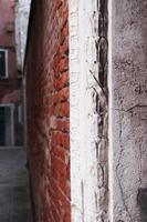 Close up view of the Fondamenta Tolentino street photo. Street scene, old wall. photo