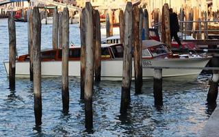 View of grand canal with boats in Venice. Canal with boat and motorboat water. photo