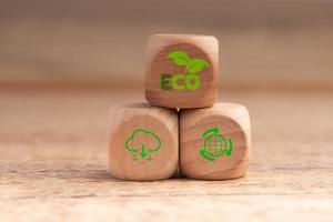 net zero concept natural environment Climate-neutral long-term strategy greenhouse gas emissions targets Wooden block with green net center icon on the natural background. photo