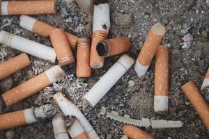 cigarette butts combined in a cigarette disc Concept of many cigarette debris after smoking photo