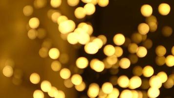 Christmas abstract golden brown defocused blur bokeh light background, 4K video background