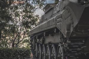 Track huge black tank close-up with copy space, army military forces vehicle photo