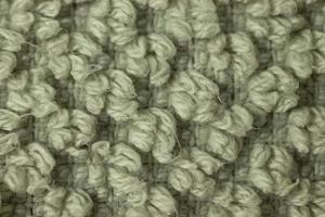 Woolen or textile white gray fibers texture background macro photo of surface