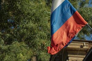 Russia tricolor national flag with copy space background. Russian federation politics photo