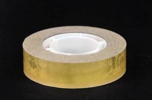 Adhesive tape on black background photo