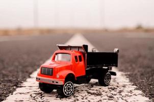 Toy truck on the road photo