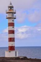 Lighthouse by the sea photo