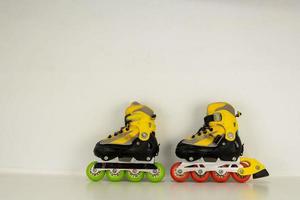 Roller skates on light background photo