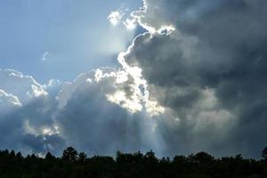 Sun beams and clouds photo