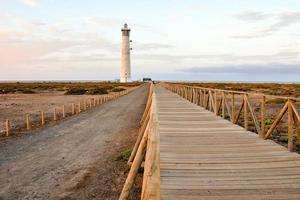 Lighthouse by the sea photo