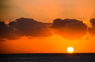 Sunset over the ocean photo