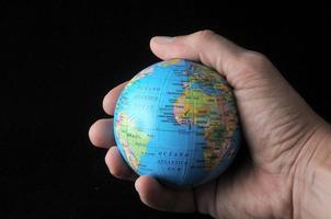 Hand holding the globe photo