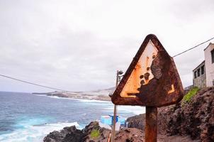 Old corroded street sign photo