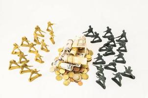 Money surrounded by toy soldiers photo