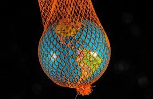 Globe in orange net photo