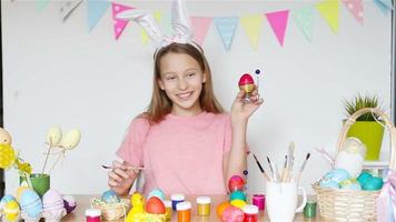 Happy easter. Beautiful little kid wearing bunny ears on Easter day. video
