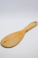 Wooden spoon used for serving rice photo