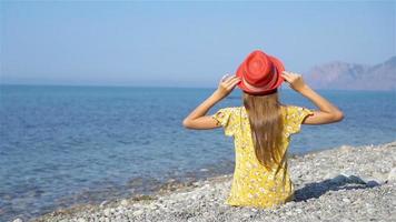 Adorable little girl have fun at tropical beach during vacation video