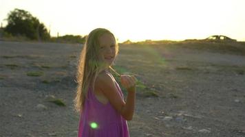 Happy kid outdoor on edge of cliff seashore video