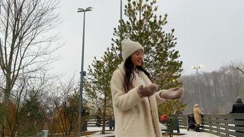 Smiling young girl skating on ice rink outdoors video