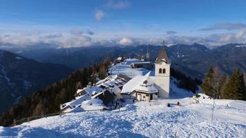 View of The Monte Santo di Lussari, Italy. Winter activities and sports. Adventurous lifestyle. Ski resort in the Italian mountains. Vacation and holidays. video