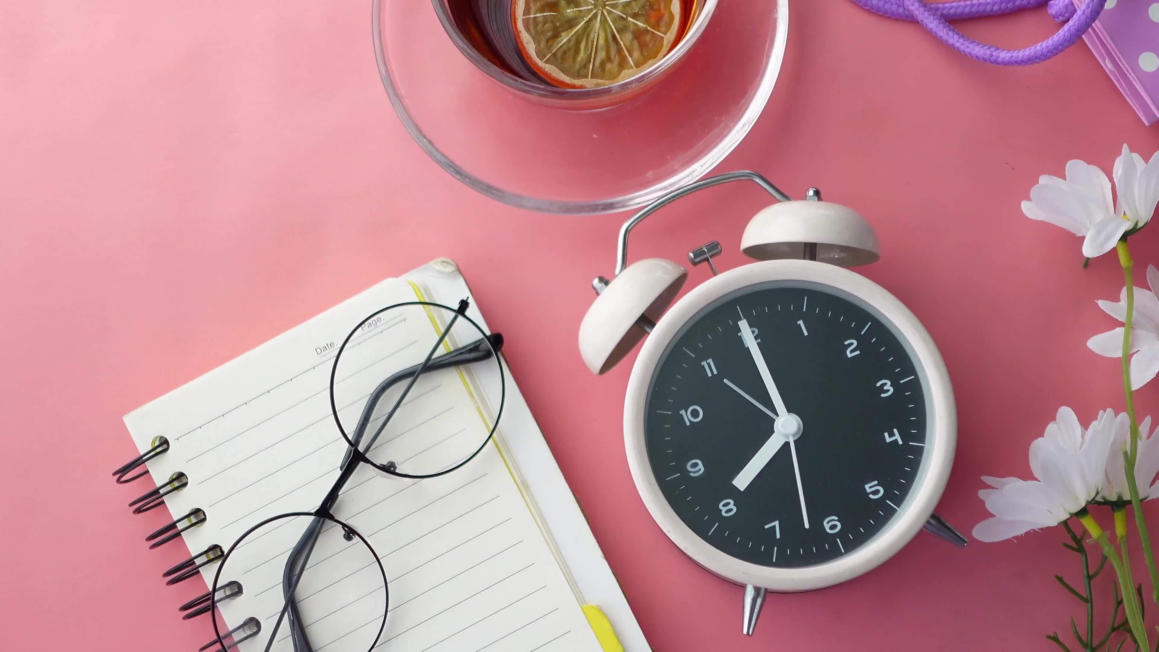 Old eyeglass on a notepad on pink background 19919275 Stock Video at