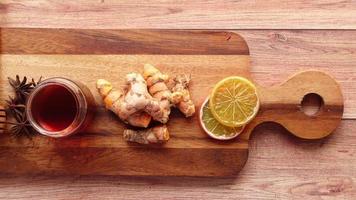 Top view of herbal tea and ingredient on table . video