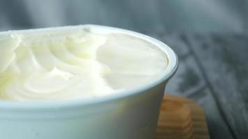 Close up of fresh butter in a container video