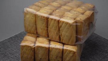 Stack of Jaggery traditional cane sugar cube on table , video