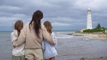 Family of three walk to the lighthouse video