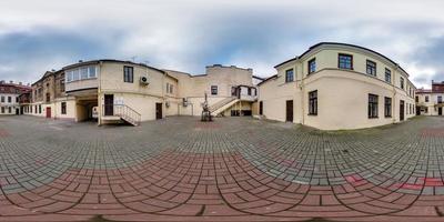 full seamless spherical hdri 360 panorama near old houses in narrow courtyard or backyard of city bystreet in equirectangular projection, ready for VR AR virtual reality content photo