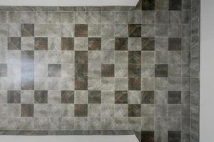 stone and ceramic floor tiles texture in corridor, view from above photo