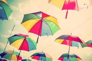 Colorful umbrella street decoration with sunlight. Vintage tone. photo