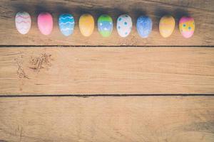 easter eggs on wooden background with space photo