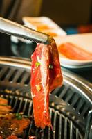 Food on Korean BBQ grill, meat and vegetable photo