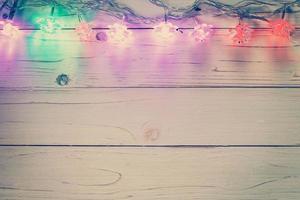 christmas light and christmas decoration on wood background with copy space. photo