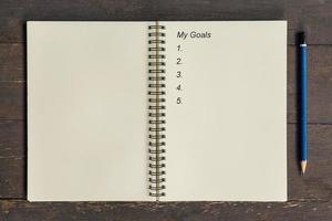 Business concept - Top view notebook writing My Goals. photo