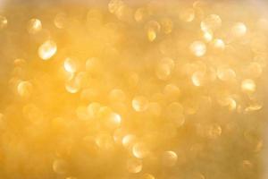 Gold bokeh and defocused background with copy space photo