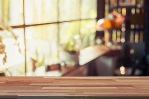 Empty wood table and Blurred background display at coffee shop with space for product. photo