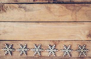 Christmas decoration with wood snowflake on table with copy space photo