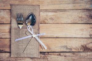 christmas table place setting and silverware on wood with space. photo