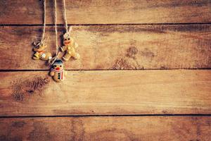 christmas decoration hanging on wooden background with space photo