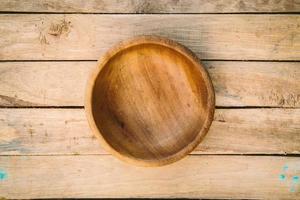 wooden bowls on wood background photo