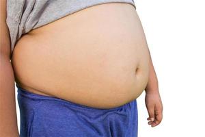 Boy fat and unhealthy on isolated white with clipping path. photo